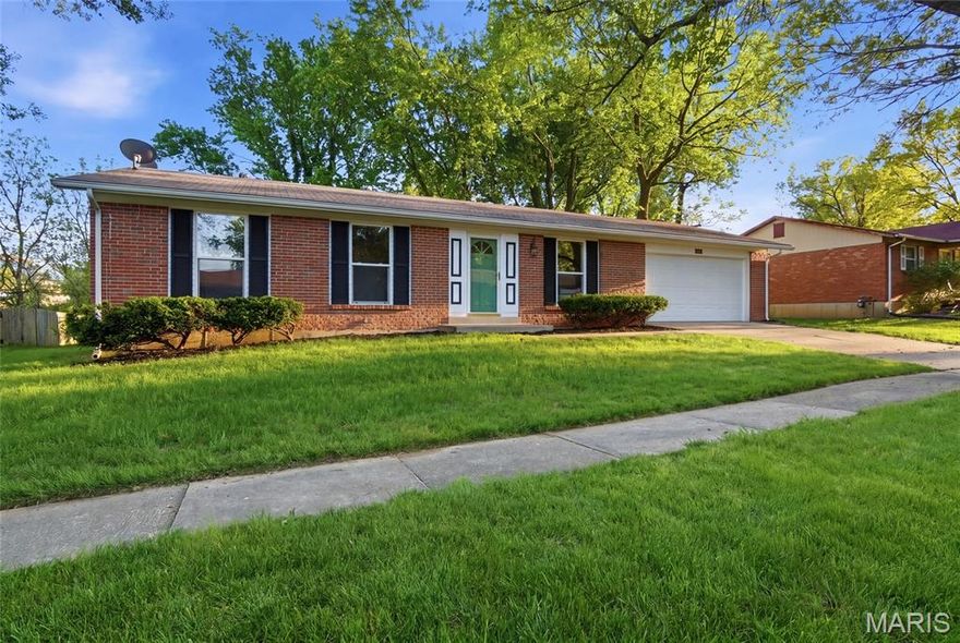 Move-in ready 3 bed, 2 bath brick ranch with beautiful hardwood floors and thoughtful updates throughout. The kitchen and bathrooms have been updated with new appliances, vanities, and fixtures, offering a great mix of style and function. Comfortable layout with connected living and dining spaces, plus well-sized bedrooms. Oversized 2-car garage provides extra depth for storage, hobbies, or a workspace. Large, clean unfinished basement offers excellent potential for additional living space. Spacious backyard on a quiet, established street with convenient access to Highway 270.