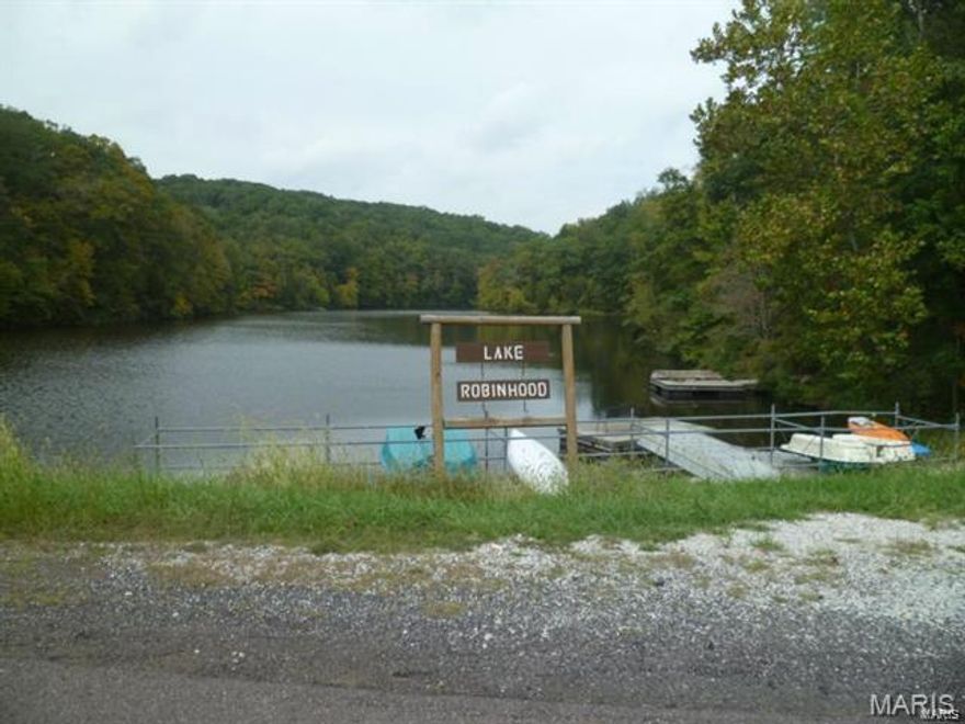 This vacant lot is ready for your second home or cabin alongside Lake Robinhood.  Lake Robinhood allows non-motorized boats, you can kayak, swim, and fish.  It is a great place to raise kids in the country lifestyle with access to many recreational amenities.  Lake Sherwood Estates is a year-round, assessment based lake community in a beautiful 1200 acre natural setting, located only minutes away from Marthasville and some of the best wineries in Missouri! There are 6 stocked lakes ranging from 3 to 135 acres.  Recreational facilities include a camp ground, swimming pool, clubhouse, tennis courts, basketball courts, parks, lakeside pavilions, public swimming docks, and a marina.  

Visit Lakesherwoodestates.net for additional details! Additional Rooms: Other