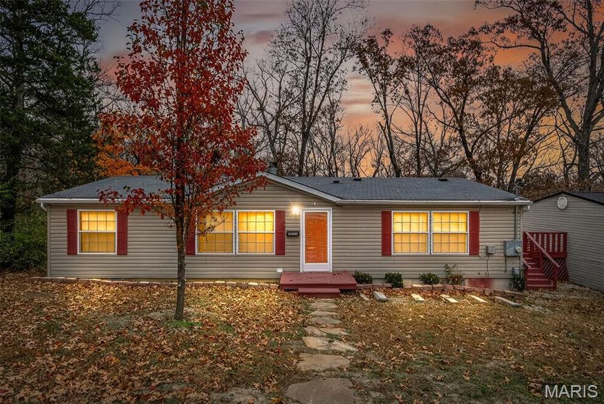 A rare find awaits you. this large 3 bedroom 2 bath home has lots to offer. Side deck that connects to the detached garage adds to the desirability of this property. Embrace the lake life you’ve been dreaming of at 3933 Zell Circle in the beautiful Valle Lake community of De Soto, MO! This inviting home offers the perfect escape with peaceful surroundings and access to all the fun the lake has to offer—boating, fishing, swimming, or simply soaking in the views. The
spacious detached garage is perfect for all your lake gear, vehicles, or even a workshop. Whether you’re looking for a cozy weekend getaway or a full-time lakeside retreat, this property delivers the perfect blend of comfort, charm, and outdoor adventure. Come see why life is better at the lake!