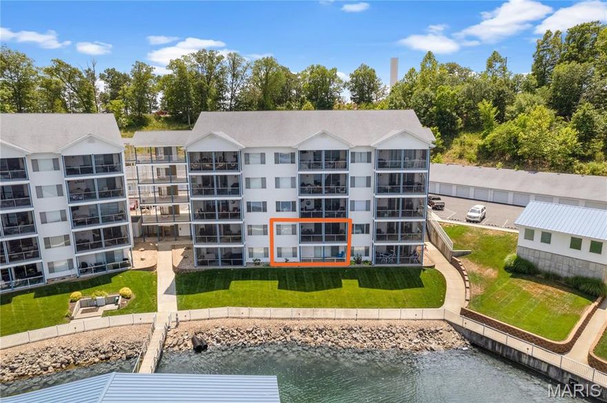 Stunning! One word describes this TRULY AWESOME unit's VIEW and Complex amenities! This large unit boasts 2 Master Suites! 2 Kitchens and Lots of room for entertaining with both a tiled patio and a screened deck! Located at the beginning of the Gravois Arm at Lake of the Ozarks, Nestled in a quiet, deeper cove area that has easy access to restaurants, gas docks and the main channel. 2 swimming pools (1 fresh, 1 saltwater) 2 dedicated swim platforms (1 with kayak launch), an exercise facility, fenced playground (with basketball & pickleball courts), and some of the best fishing at the lake will surely keep your family and guests entertained! Unit includes a 12 x 32 slip. This complex is meticulously manicured and pet friendly! Friendly neighbors and events are just some of the reasons that make Blue Anchor Bay one of the most sought after condominium destinations at Wonderful Lake of the Ozarks! Make your appointment to come experience this fabulous opportunity today! Garage available! Location: Ground Level, Interior Unit, Lower Level