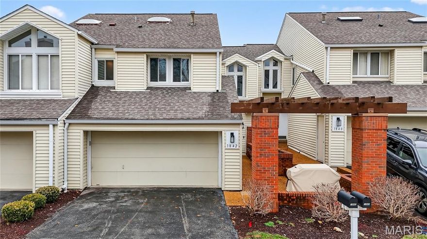 Homes like this are the ones buyers wait for, fully renovated, beautifully designed, and perfectly located in the heart of Ballwin within the highly sought-after Parkway School District. With quick access to major highways, restaurants, shopping, and everyday conveniences, the location offers the perfect balance of accessibility and peaceful living. Step inside and you’re immediately welcomed by soaring vaulted ceilings, natural light, and an open, airy layout that makes the home feel both spacious and inviting. The dramatic great room features a striking stone wood-burning fireplace and large windows that frame scenic wooded views, creating a warm and comfortable space to relax or gather with friends and family. The fully renovated kitchen blends modern style with everyday functionality. Custom soft-close cabinetry, quartz countertops, stainless steel appliances, sleek black tile backsplash, and a deep single-basin sink create a clean, sophisticated look. The peninsula offers casual seating and an easy place to gather, while thoughtful lighting and finishes elevate the entire space. Upstairs, the vaulted primary suite offers a peaceful retreat filled with natural light. The spa-inspired bath features heated tile floors, a dual vanity, skylight, private water closet, and a custom walk-in tile shower. A second vaulted bedroom includes its own en-suite bath, and second-floor laundry adds everyday convenience. The finished walk-out lower level expands the living space with LVP flooring, a spacious family room, third bedroom with walk-in closet, and a beautifully renovated full bath, perfect for guests, a home office, or additional living space. Step outside to the covered composite deck where you can enjoy quiet mornings, evening sunsets, and peaceful wooded views. Residents also enjoy access to the neighborhood community pool, adding to the lifestyle this wonderful community offers. Nearly every component of the home was updated in 2024, including a full electrical rewire, new plumbing, HVAC, water heater, appliances, flooring, drywall, kitchen, bathrooms, and lighting. Fully move-in ready and thoughtfully renovated from top to bottom, this home offers modern comfort, beautiful design, and an unbeatable location. Don’t miss out!