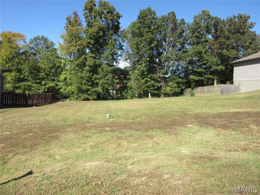 Great building lot  cleared with some trees in back with all utilities