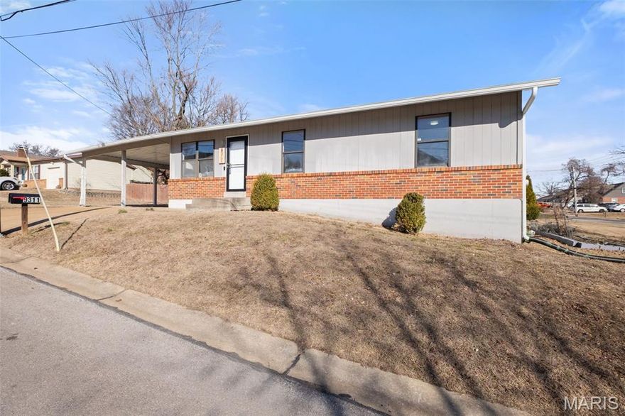 Don’t miss this rare opportunity!  A ranch home in the award-winning Ladue School District, 9311 Kenneth Place offers loads of features in a fantastic location.  Stepping inside the front door you are greeted by hardwood floors in an inviting living room/kitchen combination that caters to modern living and efficiently uses space.  The kitchen features 42-inch cabinets, stainless steel appliances, granite countertops and a spacious island.  Down the hallway you find a full bath with floor to ceiling tile, the primary bedroom with private full bath (also with floor to ceiling tile), and two additional bedrooms.  The spacious, wide open unfinished basement offers numerous possibilities for customization and loads of storage space, and the oversized attached carport provides ample parking and versatility. Incredibly convenient location just moments from popular new shopping and restaurant developments (including Costco, and very soon new Target and Dierbergs locations!) and just minutes from Clayton and the airport…Fresh paint through the main floor, corner lot, level side yard…This home checks so very many boxes.  Book your showing today!