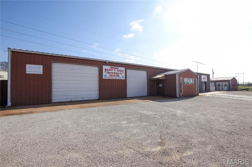 Great commercial investment opportunity situated on 2.1 acres with multiple income and business-use possibilities. This versatile property features three main buildings with a variety of functional spaces. Building 1 offers approximately 3,635+/- square feet and is well suited for shop or automotive use with three garage doors, central air, electric heat, and wood heat. The building also includes partial second-floor storage, a vehicle lift, and an air compressor that will stay with the property. Attached to the shop is a 1 bed, 1 bath apartment-style space with a full kitchen, ideal for an office, on-site living quarters, or rental opportunity. Building 2 is a secondary shop offering approximately 864+/- square feet with two garage doors and a window A/C unit, providing additional workspace or storage. Building 3 consists of a 4,400 square foot storage facility with 22 units, offering an estimated income potential of $1,500+ per month. The storage area features a gated entrance with keypad access and a large fenced outdoor area that could be utilized for additional storage to generate more income. The property is well suited for a general investor or owner-operator looking for space for an automotive shop, contractor business, landscaping company, or similar operation. 3-phase electric is available on the pole next to the building, allowing the option to easily add 3-phase service if needed. This property offers multiple buildings, income potential, and room for business growth.