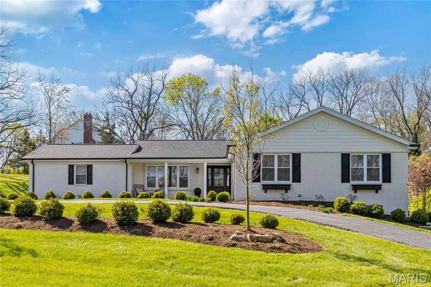 Extensively updated & expanded brick ranch home. Located on one of Frontenac’s private lanes.  Open floor plan features light-filled rooms with contemporary fixtures, plantation shutters & oak hardwoods that extend throughout the main floor. Wide covered porch entrance highlighted by architectural pillars leads to gracious foyer and formal living & dining rooms. Designer kitchen with glazed cabinetry, quartz countertops, premium appliances & 5 ½’ center island adjoins hearth room with beamed cathedral ceiling, floor-to-ceiling stone fireplace flanked by built-in bookcases & atrium door that opens to patio. Primary bedroom suite with walk-in closet & luxury bath with skylight offers an appealing retreat. 3 Additional bedrooms & hall full bath complete the main floor living quarters. Lower Level entertainment space includes expansive recreation room plus office, 5th & 6th bedrooms & full bath. Situated on a tree-lined 1+ acre cul-de-sac lot with patio, circular drive & 2-car garage.