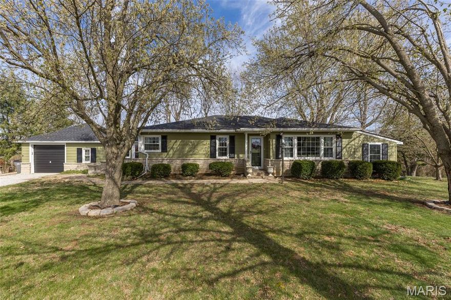 The photos truly say it all—this beautiful property is ready for its next owner to move right in and enjoy. Featuring 3 bedrooms and 2.5 baths, this home offers the perfect combination of modern upgrades and peaceful country living.  Ideally located on Hwy 61 just south of Bloomsdale and only minutes from Ste. Genevieve, the home sits on 1.38 acres with picturesque views in every direction. The kitchen is both functional and inviting, while the finished sunroom adds approximately 300sqft of additional living space—perfect for relaxing or entertaining year-round. An enclosed breezeway offers versatile space that can serve as a mudroom, home office, man cave, or hobby area.  Outside, you’ll appreciate the large carport with plenty of room for RV or boat storage, along with a one-car attached garage for added convenience. This property truly checks all the boxes!