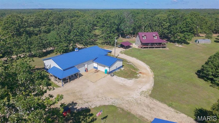 Rare find! Built in 2021, this charming house is loaded with upgrades and set on approximately 4.5 (+/-) private acres. The home features three bedrooms, 2.5 baths, and a partially finished walk-out basement. Enjoy peaceful outdoor living with a wraparound covered porch, circle drive with parking for up to eight vehicles, a two-car carport, and two lean-tos - absolutely perfect for storing your camper, tractor, or boat. Inside, the open kitchen, living, and dining area showcases vaulted wood ceilings and a mix of wood and galvanized tin accent walls. The kitchen includes a farmhouse sink and island, while the primary suite offers a relaxing clawfoot tub and separate shower. Double-pane, double-hung windows add energy efficiency throughout. The impressive insulated metal shop includes a 23x23 bay with an 8x12 overhead door, plus a 40x64 section with two 10x10 overhead doors, 12-foot metal ceilings, painted concrete floors, an office, half bath, storage area, 10x30 lean-to, and an 18x22 wraparound porch. The detached garage measures 24x32 with an 8-foot roll-up door, walk-in door, and 14-foot lean-to. Sellers are related to Wendy Reddit, a licensed REALTOR. Note: 2025 property taxes reflect the full 16-acre parcel.