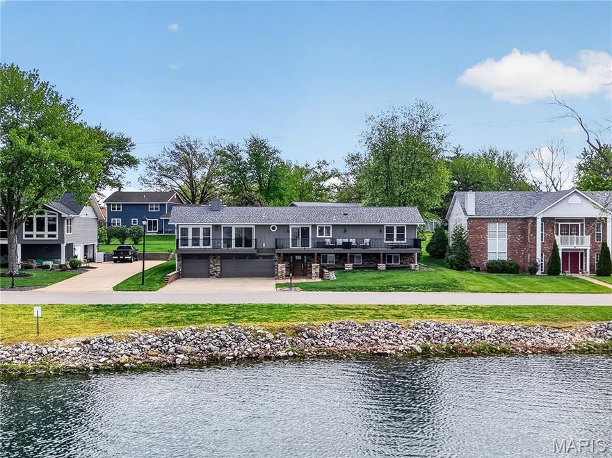 One-Of-A-Kind Custom Designer Raised Ranch offering STUNNING WATERFRONT VIEWS of peaceful Lake St. Louise! Rare opportunity to ENJOY the LAKE ST LOUIS COMMUNITY ASSOCIATION lifestyle & feel like you’re on VACATION every day w/ Lake Rights & RESORT STYLE Amenities! Move-In Ready 2,717+ sq ft featuring 4 Bedrooms, 3 Baths & a 3 Car 25’ EXTRA DEEP Garage. HIGH END UPDATES THROUGHOUT — practically EVERYTHING is NEWER! Hardwood Floors accent the Main Living Areas. The UPDATED CHEF’S Kitchen impresses w/ an Expansive Culinary Island, GRANITE Counters, Designer Tile Backsplash, 42” Upper Shaker Cabinets, Wall of Pantry Cabinets, Gas Range, Chef’s Exhaust Hood & Stainless Appliances- French Door Refrigerator stays! Kitchen Slider opens to the Massive 40’ Front Composite Deck overlooking the LAKE — a SHOWSTOPPER! Cozy evenings await by the Stacked Natural Stone Gas Fireplace in the Vaulted SHIPLAP Great Room w/ a Wall of Slider Doors leading to the Composite Balconette. Dining Area, Glass 4 Season Room, Butler’s Pantry & Laundry Room complete the luxurious design. Owner’s Suite w/ Walk In Closet PLUS Bonus Closet & a Tiled Owner Bath featuring a Stunning Step In Shower. Bedrooms #2 & #3 share the Tiled Hall Bath. Welcoming Ground Level Entry offers a Spacious Family Room, Bedroom #4, Full Bath, Multiple Closets & Excellent STORAGE. Level Backyard w/ Composite Deck, Patio & Playset. Kayak, Paddleboard, Float or RELAX on the Jetty at Guyenne Park across the street. Boat Launch just around the corner! WENTZVILLE SCHOOLS. Too much to list! A MUST SEE to fully EXPERIENCE everything this Exceptional Home with Waterfront Views has to offer!