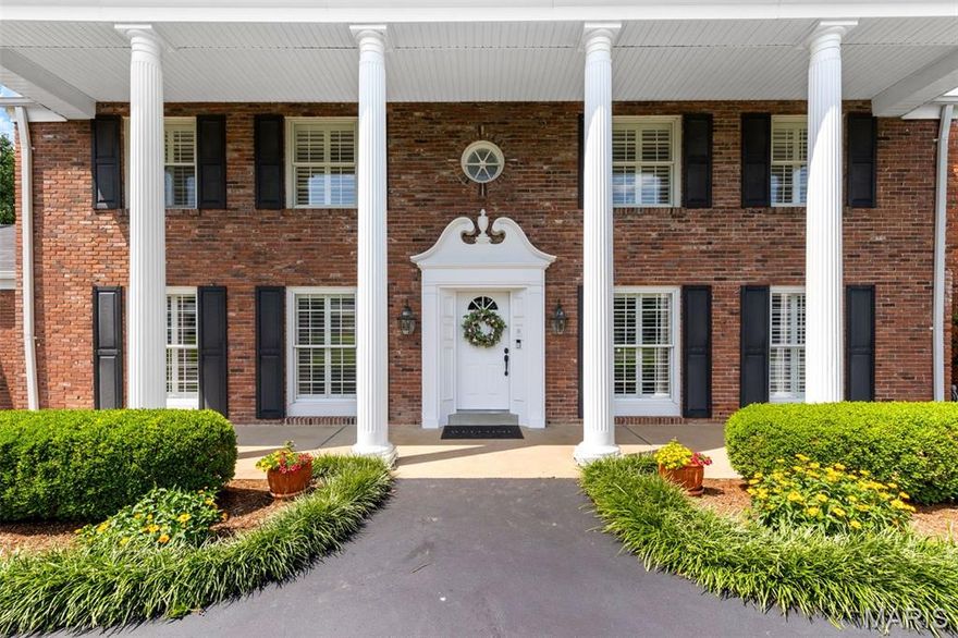 Timeless Colonial elegance meets modern comfort in this beautiful and spacious 4-bedroom, 5-bath home on a manicured 1-acre lot in a private, gated West County neighborhood. With over 3,500 sq ft, the home features stately pillars, plantation shutters, and a backyard oasis with inground pool, composite deck, and lush landscaping.  A sun-filled vaulted sunroom with full window walls offers seamless indoor-outdoor living. Inside, the kitchen features custom cabinetry, granite counters, stainless appliances, and a newer (Jan 2024) KitchenAid refrigerator. Two wood burning fireplaces, zoned HVAC, and a spacious primary suite with sitting area and updated en-suite bath add comfort and style.  Additional highlights include Pella windows, newer main furnace (2023), refinished driveway (2022), and a finished lower level with rec space and half bath. All 4 bedrooms and 3 full baths are upstairs. Neighborhood amenities include pool and tennis. Parkway West/Mason Ridge schools and unbeatable location near hospitals, shopping, and highways.