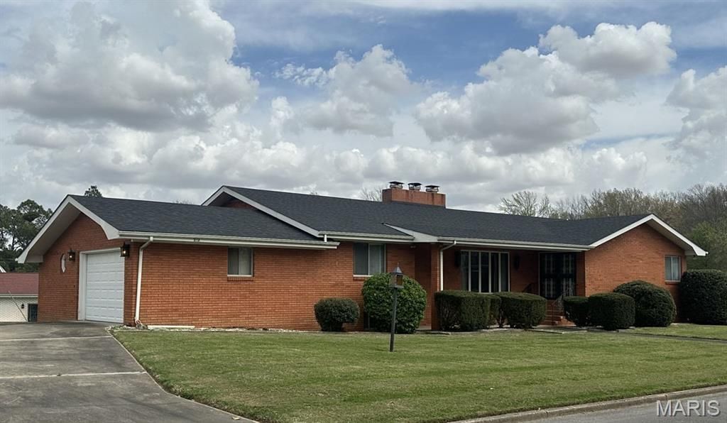 Photo of 707 Trotter Lane, Dexter, MO 63841 (MLS # 26020167)