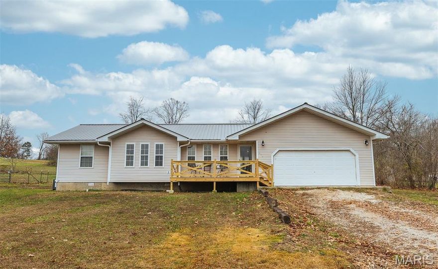 Inviting 3 bedroom, 2 bath ranch-style home featuring a spacious and open floorplan designed for easy living. A large brand-new front deck welcomes you inside, where you’ll find laminate flooring and vaulted ceilings that create a bright, airy feel throughout the main living spaces. All three bedrooms are generously sized, offering plenty of comfort and flexibility.

Step out back to enjoy a newly built rear deck overlooking a level backyard—ideal for outdoor gatherings, play, or simple relaxation. A large storage shed provides ample space for tools, lawn equipment, and extra storage needs. This well-maintained home delivers comfortable living inside and out, with updates that make it truly move-in ready.