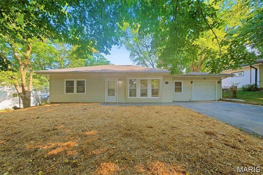 Exceptional Fully Renovated Three Bedroom Ranch Home on Slab Foundation Featuring Two Car Oversized Tandem Garage on Double Driveway, Brand New Roof, New HVAC Furnace & A/C Systems, Updated Energy Efficient Vinyl Windows, and Stunning New Flooring Throughout! Large Front Living Room with Overhead Recessed & Ceiling Fan Lighting, Corner Wet Bar w/ Built-In Shelving, Coat Closet, and Three Large Windows allowing for Plenty of Natural Light. Separate Dining Room Adjacent to Brand New Kitchen with Walls of Cabinetry, Butcher Block Countertops, and Full Set of Stainless Steel Appliances! Spacious Master Bedroom with Overhead Ceiling Fan Lighting and Two Large Closets. Two Additional Generous Size Bedrooms with Large Closets share Brand New Bathroom with Ceramic Tiled Shower Walls & Flooring. Enjoy the Coming Spring Season from the Brand New Deck Overlooking the Full Fenced Backyard. Call Your Full Time Realtor for Questions or to Schedule Your Showing Today!