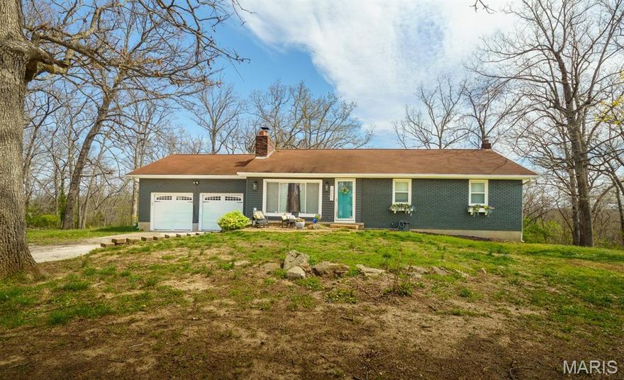 WELCOME TO THIS PLEASANT 4-bedroom, 2-bath home nestled in an appealing country subdivision. Numerous upgrades completed within the last five years—including siding, windows, flooring, & HVAC. The kitchen offers abundant cabinet space, attractive quartz countertops, stainless appliances, & an open layout that flows nicely to both dining & living areas. The spacious living room features warm natural light & timeless brick fireplace.  The primary bedroom is conveniently located on the main level & includes a private bath with a walk-in shower. The basement expands your living space with a large family room, additional bedroom or could be home office or workout room, and a versatile bonus room that could serve as a sleeping area or library.  There is a 13' x 17' m/l mechanical room that provides additional storage options.  Out the back is a deck, that has been rebuilt, & lower patio, perfect for entertaining or relaxing around a firepit. The large lot is shaded with mature trees & backs to woods, providing a private setting. This home is minutes from town & local golf course.  The beautiful Meramec Springs Park is just a few miles away as well!!  Call for your private tour today!
