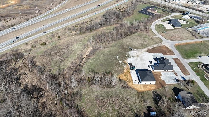 Excellent opportunity to own 2.03+/- acres (Lot 3) of commercial land in Moscow Mills. Located within a Business Park / Industrial Park setting, this property offers outstanding potential for a wide range of commercial or light industrial uses. The lot provides ample room for building, parking, and operational space, while still allowing flexibility for future expansion. Its convenient location offers easy access to major roadways and nearby communities, making it an attractive option for businesses looking to establish or expand their operations. With ongoing growth and development in the Moscow Mills area, this property presents a great investment opportunity for developers, business owners, or investors seeking commercial land in a thriving location.