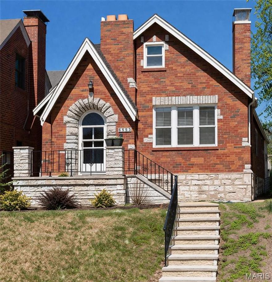 Classic South City home perched gracefully above iconic, tree-lined Lindenwood Place. Relax on the inviting front porch and enjoy the charm of this beloved neighborhood. Beautiful architectural details abound throughout this welcoming 4-bedroom home. The spacious living room welcomes you with gorgeous window views and immaculate hardwood floors.  A main-level bedroom and updated full bath with a stand-alone shower and pedestal sink offer added flexibility for guests or everyday living. The kitchen features oak cabinetry, quartz countertops, and functional workspace. A large family room addition opens to the lovely fenced yard and connects to the two-car garage. Upstairs, you’ll find two additional bedrooms and a full bath, providing comfortable and versatile living space. Ideally located within walking distance of neighborhood favorites including Blueprint Coffee, Pietro’s, and beloved Lindenwood Park.