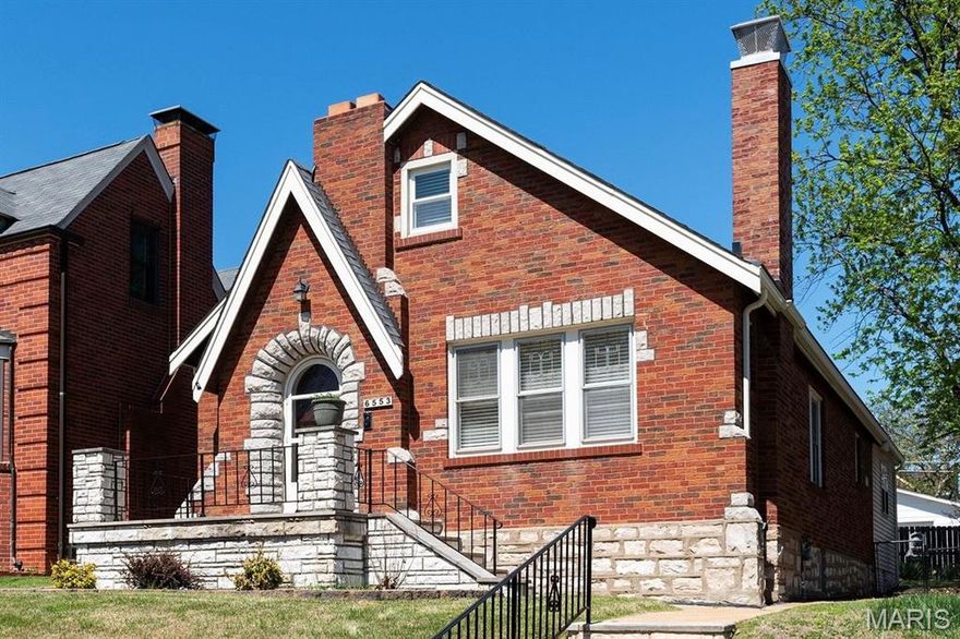 This classic South City home is perched gracefully above the iconic, tree-lined Lindenwood Place. Relax on the inviting front porch and enjoy the charm of this welcoming and friendly neighborhood. Beautiful architectural details abound throughout this 4-bedroom home. The spacious living room welcomes you with gorgeous window views and immaculate hardwood floors.  A main-level bedroom and updated full bath with a stand-alone shower and pedestal sink offer added flexibility for guests or everyday living. The kitchen features oak cabinetry, quartz countertops, and functional workspace. A large family room addition opens to the lovely fenced yard and two-car garage. Upstairs, you’ll find two additional bedrooms and full bath.  Either could be outfitted for a very functional office space.  Located within walking distance of Blueprint Coffee, Pietro’s, and of course Lindenwood Park.  This is the best of wonderful S. City.