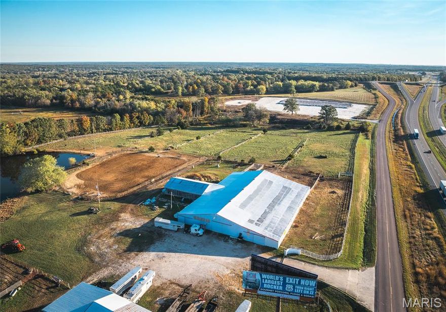 LARGE 59'x160' INDOOR RIDING ARENA w/ Office, Tack Room, Concession and Storage Rooms, and soft earth Boarding Stalls, in addition to daily use stalls on 13.45 ACRES with an OUTDOOR RIDING ARENA w/CHUTES and a pond is now available!  The HIGH-TRAFFIC I-44 VISIBILITY of this location offers so many opportunities for new business.  This property can be purchased along with the adjoining 20+ Acre property to the west (24265 Vinyard Rd, MLS #25014716) for a truly unique opportunity to have everything you could need for an Equestrian Dream Facility in one location!