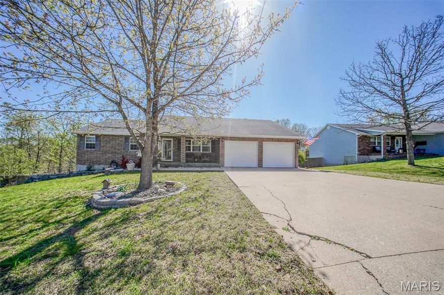 Welcome to this spacious 4-bedroom, 2.5-bathroom home nestled on a generous 1.57-acre lot m/l in the heart of Waynesville. Many updates to include: new roof, new deck, new gutters, and shutters! This beautiful property features a finished walk-out basement & a fully fenced backyard with a peach tree—perfect for outdoor living & entertaining. The main level offers a bright & open layout where the living room flows seamlessly into the dining area, which opens to a large back deck with serene views. The kitchen is equipped with sleek stainless steel appliances, a breakfast bar, & nearby laundry for added convenience. Retreat to the primary suite featuring a walk-in closet, double vanity, jetted corner tub, separate shower, & a cozy attached nursery.  Downstairs, you’ll find a spacious family room with a propane fireplace, three additional bedrooms, a full bath, & a bonus room with a closet—perfect as a 5th non-conforming bedroom or office space. This home offers room to grow both inside and out! Don't miss this one! Schedule your private showing today!