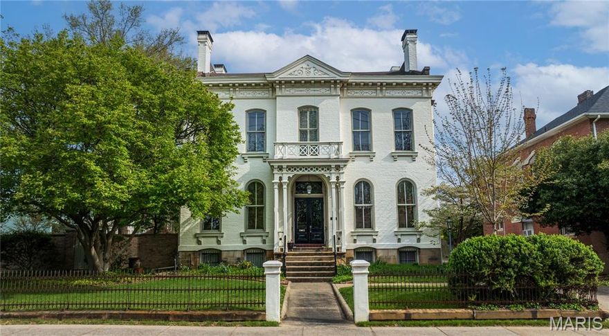 Step into timeless elegance with this brick Italianate Historic Treasure. On the Historical Registry, built in 1883, this home has been lovingly preserved with only 4 owners, each honoring its remarkable legacy. From the moment you arrive, you are in awe, from the elaborate porch and original double set of doors welcoming you to a grand foyer with a 3 story original staircase with cherry newel post. Soaring 12 foot ceilings on the main floor and 8-foot windows flooding each room with natural light and highlighting architectural details at every turn. The main-level office features built-in bookcases along with an original fireplace and mantel. The living and dining room - historically known as a double parlor-showcase matching marble fireplaces and flow seamlessly into one another, creating an inviting space that’s perfect for entertaining guests or enjoying a relaxing evening at home. A large modern kitchen with custom cherry cabinets, stunning pecan butlers pantry, viking gas cooktop and regency double oven opens to the den with bay window and iron spiral back staircase leading to the 2nd floor. Upstairs features impressive 11-foot ceilings complemented by an abundance of windows that flood the space with natural light creating an open airy feel throughout. Large primary bedroom with fireplace, sitting area, ensuite bath and walk-in closet. A captivating library with floor to ceiling bookcases, plaster cornices and slate fireplace. You’ll also find an additional bedroom with its own ensuite bath and another versatile bedroom or office space to fit your needs, along with the convenience of a 2nd floor laundry area for everyday use.The 3rd floor has 2 additional bedrooms or could be used as an additional hangout space and bedroom along with a full bath. The 7 fireplaces add warmth and sophistication, creating inviting spaces in nearly every room. The full basement with a walk-up is currently used for storage, a tinkering space and wine cellar. Gracefully positioned on a corner lot with the original wrought iron fencing and a 6 foot brick wall enclosing a private courtyard with fountain, charming brick paths, multiple spaces for dining, sitting and gardening plus a garden shed - but best of all privacy and charm. Ample parking with private back drive and side driveway that makes a full circle around the house. 3 HVAC systems for each floor and an operating up to date boiler system as well. The current owners have loved and restored this home over the last 30 years. It is more than a home—it’s a rare opportunity to own a piece of history, where elegance, character, and story come together and now ready for its next chapter.