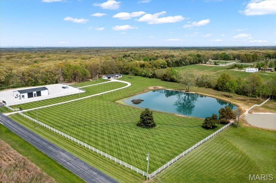 Escape to your own private retreat with this gorgeous 4-bedroom, 3-bath estate, featuring modern upgrades, upscale finishes, and breathtaking views from every angle. This fully renovated, brick ranch offers a bright open floor plan and stylish interior designed for both everyday comfort and high-end living. Nestled on 13.22 acres, the property offers multi-use zoning—.99 acre commercial, 1.1 acre residential, and 11.22 acres agricultural—providing a unique opportunity to live, work, and unwind all in one location. Enjoy stunning countryside views, fishing in your private lake, and abundant wildlife for hunting, right outside your door! A separate gated entrance leads to a premium 70' x 50' outbuilding with two finished office spaces, and a half bath, ideal for a home business or creative space. Enjoy sweeping views of the countryside, one-acre stocked lake, and the peace of a private, wooded backdrop. This exceptional estate offers the perfect balance of luxury and functionality. COOL: 14 SEER+