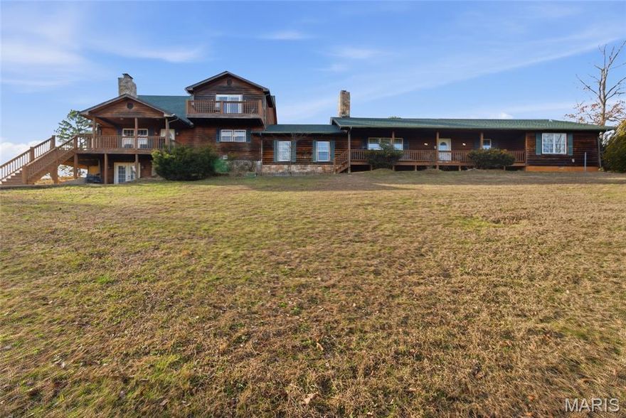 River Ridge Cabin & Lodge – Turnkey Investment or Private Retreat Near the Current River

Known as River Ridge Cabin, this incredible 7,000 sq. ft. m/l rustic lodge sits on 10 acres m/l and is composed of four beautifully decorated cabins all under one roof, offering the perfect blend of charm, flexibility, and income potential. Currently set up for vacation rentals, each cabin is fully furnished and features its own kitchen, bathroom, and private exterior access, while also allowing the entire structure to be used as one expansive living space.

The lodge offers a total of 11 bedrooms, 7 bathrooms, 4 kitchens/dining areas, a sunroom, two laundry rooms, and a large common game room complete with pool table, shuffleboard, and arcade games. Multiple wood-burning fireplaces, spacious decks, and scenic Ozark views create an inviting atmosphere for guests or family gatherings.

Also this property has ample Cellular Service and Star Link connectivity for business or pleasure while resting away. 

Outside, the property includes 2–3 RV setup spots with water, electric, and septic, with room to add more. A company website is included in the sale, adding immediate value for continued rental income.

Located approximately 1 mile from the Current River, this property is surrounded by some of the best outdoor recreation in the area including hiking and walking trails, Mark Twain National Forest, Peck Ranch, Big Springs, and Rocky Falls. Shopping, dining, and all the beauty of the Ozarks are just a short drive away.

Whether you’re looking for a high-performing vacation rental, corporate retreat, or private family compound, this one-of-a-kind property is a rare opportunity. This is truly a must-see property that will leave you in awe!