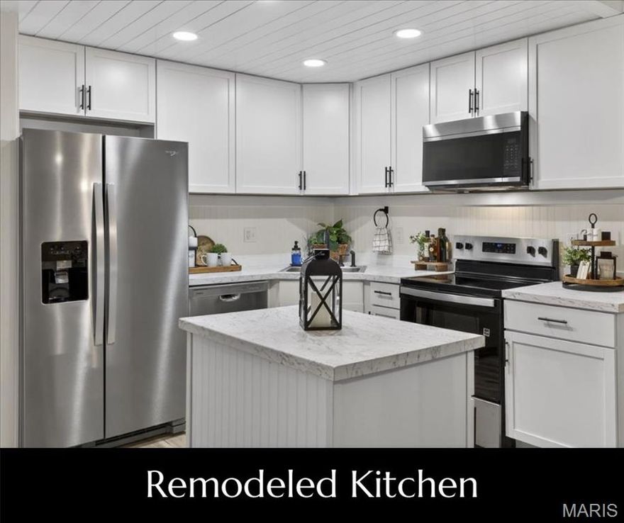 Retreat to 1400 Heritage Landing #203—a thoughtfully renovated 2-bedroom, 2-bathroom WALK-IN condominium offering an open floor plan and modern upgrades throughout. The completely redesigned Kitchen combines function and style with new 36" cabinetry & countertops, stylish hardware, custom backsplash, sink + faucet, and a custom island that anchors the space. The Kitchen opens seamlessly to the Living and Dining areas creating a place to gather or entertain. Both bathrooms have been fully updated with new white vanities, tub/shower and shower surrounds, sleek finishing touches: faucets, light fixtures, mirrors, shelving and hardware. A newly added Laundry Center is discreetly tucked off the Kitchen and adds a layer of everyday convenience without sacrificing style. Fresh wall and ceiling paint throughout enhance the bright, contemporary look, while durable LVP flooring at the main living areas and new carpet at the bedrooms, add comfort.  Additional highlights include custom millwork, baseboards + trim throughout and unique shiplap ceiling at the Kitchen. The one-of-a-kind cubbie area in the Entry Foyer is the perfect combination of style and organization. Assigned carport, additional parking and NO STAIRS make this unit easy to access. New slider gives access to the deck that overlooks the community courtyard. Added bonus - secure closet with storage locker plus community Laundry Center. Heritage Garden is not just a condo complex it's a community. Check out the improvements! Centrally located in St. Charles with easy access to shopping, dining, recreation and major highways, this move-in-ready condo delivers quality craftsmanship, style, and low-maintenance living at a premium location. NOTE: new SELLER CONCESSION: Seller will credit Buyer $2000 towards closing costs OR towards HOA dues at closing.