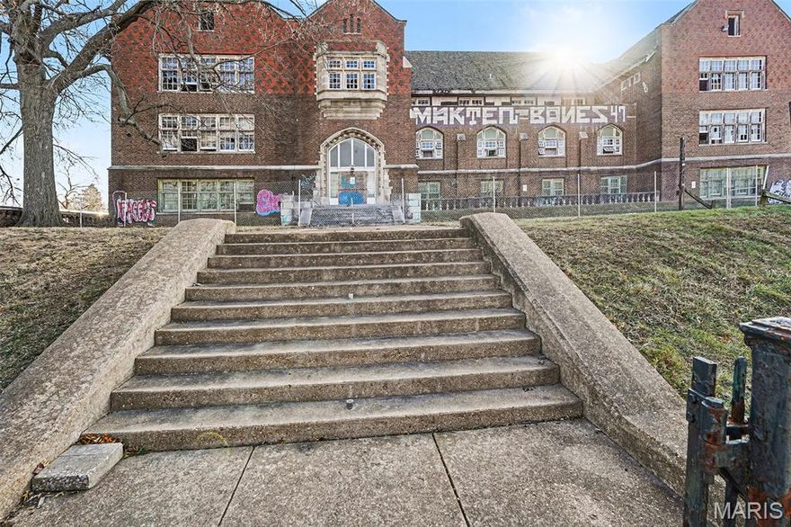 Historic School Building with Prime Kingshighway Frontage
This property features an approximately 31,375-square-foot, three-story masonry building situated on a 4.32-acre fenced and paved site with exceptional visibility along North Kingshighway Boulevard at Interstate 70. Originally constructed in 1924, the building retains significant architectural character and was designed by noted architect R. M. Milligan.
The structure includes a full gymnasium, large floor plates of approximately 15,500 square feet, and intact architectural details, making it well suited for adaptive reuse, institutional, community, educational, or redevelopment purposes. The low building FAR provides flexibility for future site expansion or reconfiguration.
Located within an Opportunity Zone, the property benefits from strong traffic counts, access to public transportation, and proximity to major arterial roadways. The expansive land area, combined with the building’s historic character and strategic urban location, presents a compelling opportunity for investors, developers, or end users seeking a value-oriented acquisition with long-term upside. SLPS