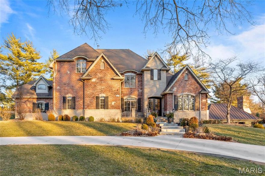 Spectacular renovation. This beautifully designed brick & stone Estate home features best-in-class improvements, fixtures & amenities including refinished oak hardwoods, detailed trim work, contemporary lighting & plantation shutters. Impressive hardwood foyer highlighted by dramatic flared staircase leads to well-appointed study with French doors, elegant dining room framed by arched entryways & architectural pillars and striking great room with granite fireplace flanked by built-in bookcases, 2-sty bow window & wine bar. Culinary enthusiasts will love the designer kitchen with custom cabinetry, granite countertops, Café appliances & 10’ center island. Light-filled breakfast room & hearth room with box beam ceiling & full-height stone fireplace provide a welcoming gathering place. Spacious primary bedroom suite offers an appealing retreat with customized walk-in closet, wide bay window & luxury bath. Hardwood floors continue to the 2nd level with 4 additional bedrooms, 3 with ensuite baths. Walk-out Lower Level includes recreation room & game room with 2-sided fireplace & media room with entertainment center plus 2nd kitchen, wine room, workout room & full bath with steam shower. Atrium doors open to outdoor living room with grilling station, covered & open patios, pool & hot tub surrounded by landscaped gardens.