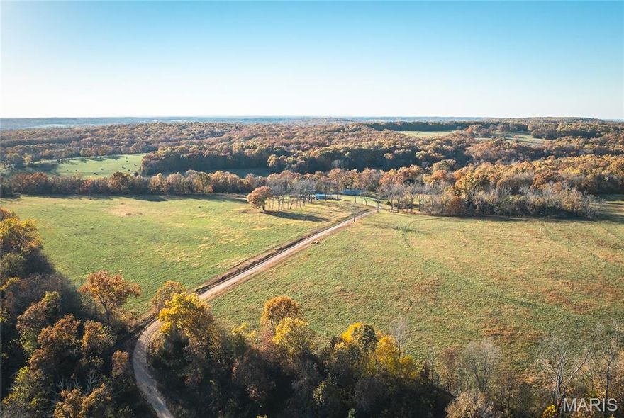 Located in Texas County, Missouri, this 200 m/l acre property offers the perfect blend of productive farmland, comfortable living, and recreational opportunity. With a great mix of open pasture and wooded acreage, this farm is ideal for raising cattle, hay production, hunting, or simply enjoying the beauty of rural Missouri. The property features an earth home with 3 bedrooms and 2 full bathrooms, offering energy efficiency and year-round comfort. A greenhouse and fenced garden area provide the perfect setup for growing your own produce, while an equipment barn offers storage for tools, tractors, and farm machinery. The land itself is well-suited for hay production or cattle farm, featuring gently rolling pastures and a pond on the property. The balance of wooded land makes for excellent hunting opportunities as Texas County is known for its abundant deer and turkey population, providing outstanding recreation right out your back door. Located approximately 1.5 miles off Highway 38 on a gravel road, the property offers great privacy while remaining conveniently close to main road access.