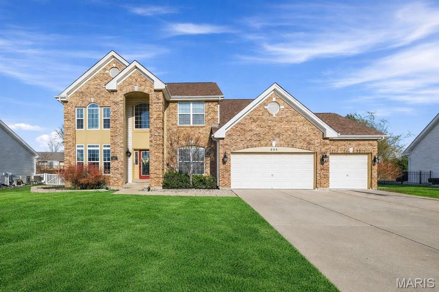 Stately and beautifully maintained, this Bainbridge home captures attention with timeless curb appeal, welcoming charm, and lush yet low-maintenance landscaping. From the moment you arrive, you’ll notice the pride of ownership and thoughtful updates throughout. Step inside to an open floor plan filled with natural light. At the heart of the home is a stunning gourmet kitchen featuring satin granite countertops, stainless steel appliances, and a spacious center island that flows seamlessly into the inviting family room—perfect for entertaining, holidays, or everyday living. The cozy fireplace anchors the family room, creating a warm and stylish gathering space for any occasion. Upstairs, retreat to the expansive 20x15 primary suite, a true private sanctuary complete with a spa-inspired bath and generous walk-in closet. Three additional bedrooms with beautiful wood flooring provide flexibility for family, guests, or dedicated office space, while a versatile loft area adds even more options for work or relaxation. The finished lower level expands your living space with room for recreation, media, fitness, or hobbies. Step outside to your private backyard oasis, ideal for summer barbecues, playtime, or relaxing evenings under the stars. Located in the highly sought-after Bainbridge neighborhood in Dardenne Prairie, residents enjoy access to a private community pool and a full calendar of neighborhood activities, top-rated schools, parks, shopping, and dining.