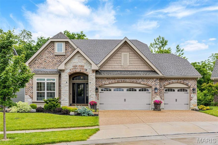 This 5-year-young luxury ranch with all the extras blends sophistication, comfort, and smart design. One of the very best lots on Grand Reserve, backing to trees for year-round privacy and wildlife viewing. Featuring 2 ensuite bedrooms (one on each level), 2 additional bedrooms, and 4 full baths, it’s ideal for flexible, modern living. The open layout flows to a full-width deck with built-in lighting, screened porch, and oversized hot tub with lights and sound system. Backing to tree-lined common ground, enjoy year-round serene wooded views, a professionally landscaped yard, and upscale finishes throughout. The kitchen boasts double ovens and a built-in coffee system with app controls, microwave drawer, walk in pantry and convenient cookpot filler at stove. The main-level primary suite offers heated floors, a digital shower, and an extra large custom walk-in closet with premium shelving and shoe storage - a must-see. Oversized newer hot tub, six mounted TVs, fridge, washer, and dryer ALL stay with the home, as well as all upgraded appliances as viewed. Other features include a desirable 3-car garage, integrated sound system inside & out, main-level laundry, and a secondary laundry hookup in the lower level. Every detail is designed for easy living and exceptional style. Be sure to check out the video!