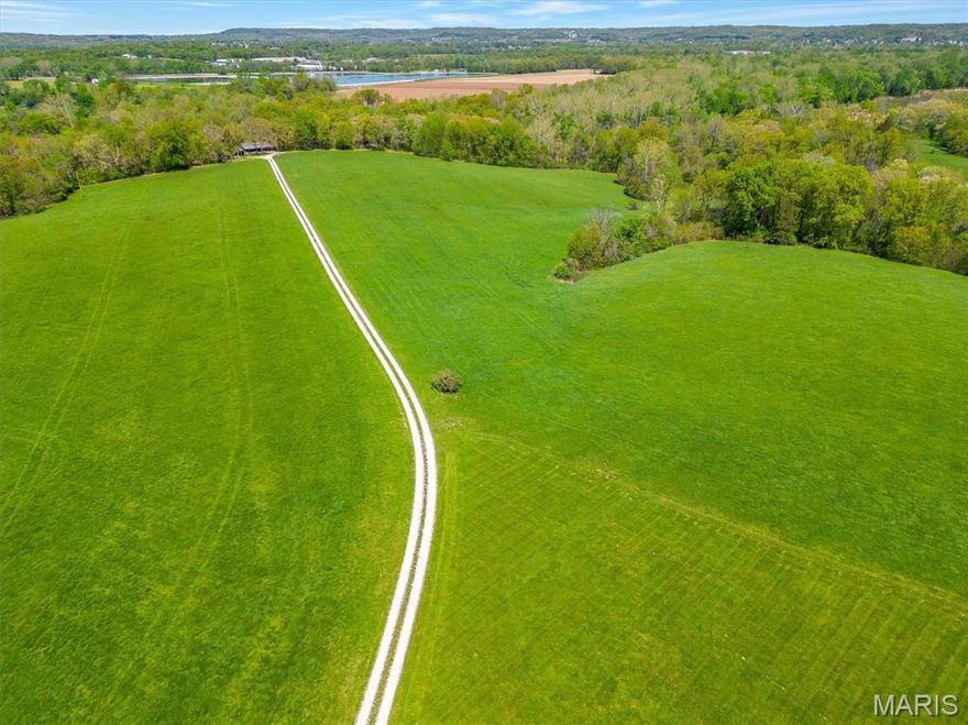 Looking for a great farm, recreational land? This is it. Just outside of Pacific lays 77 acres that has so much potential. With Meramec River frontage you don't want to miss out. The views are gorgeous and summer evenings on that river would be magical.   The majority of the property is currently used for hay. The property has a few club houses on it. The clubs houses can be seen with proof of funds/ accepted offer.