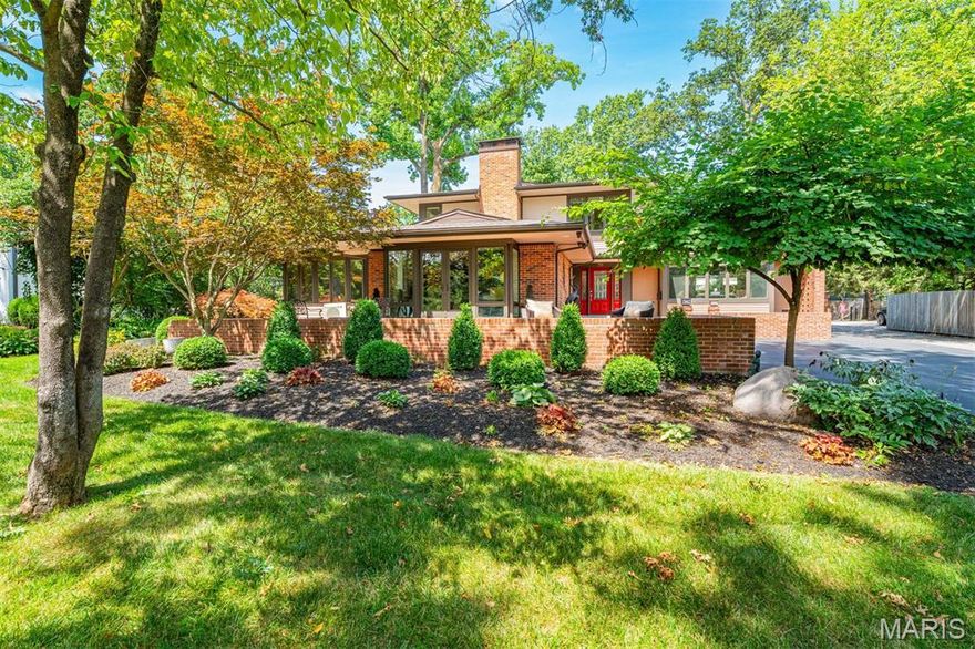 Tucked away in one of Webster Groves' most desirable neighborhoods, every inch of this prairie style home has been meticulously renovated within the past 5 years. A deep front patio leads to the charming red entry door. Behind the door two generously sized gathering spaces flow into the light filled sun porch (used as a dining room) and large chef's kitchen. Renovated in 2022, the eat-in kitchen boasts a walk-in pantry, quartzite counter tops, a luxury Ilve range, and ample space for multiple cooks to work together. Completing the main level is a private primary suite with two walk-in closets (one with a full-sized washer and dryer), a designer bath, and French doors leading out to the pool area. Located upstairs are the original primary suite with ensuite bath and walk-in closet and two additional bedrooms and another full bath. The partially finished basement includes a sauna which will remain with the home. The owners' attention to detail does not stop with the inside spaces. Beginning in 2019, the backyard space has been transformed into a private oasis comprised of a dining/grilling area, firepit, hot tub and custom pool. Rounding out the improvements is an oversized three car garage and motorized gate allowing for additional privacy and security. The attention to detail is evident in every corner of this home. This sophisticated and luxurious Webster Groves gem is ready to find its new owners.