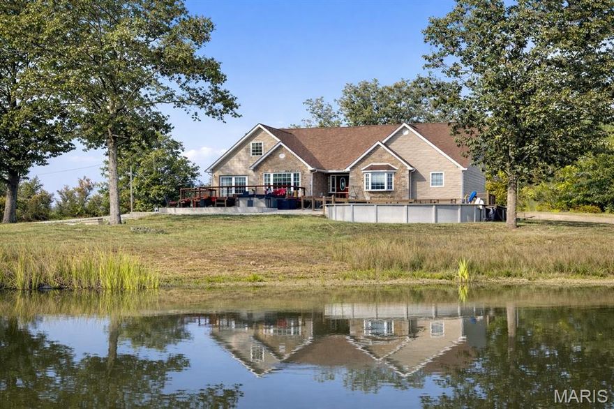 Step into your own private retreat on 12 beautiful acres—soon with spring blooms, summer sunsets, and peaceful pond views and create the lifestyle you’ve been dreaming of. This stately home offers over 3,500 sq ft of space to spread out, entertain, and truly enjoy the seasons ahead. Imagine morning coffee overlooking rolling acreage, afternoons by the pool, and evenings gathered around the firepit under wide-open skies.
Inside, you’ll find a bright, spacious kitchen with walk in pantry that opens to the dining area—perfect for hosting family and friends. The great room invites cozy nights in, while the home’s thoughtful layout provides flexibility for every stage of life. The private primary suite is tucked at the back of the home and features a spa-like bathroom with jetted tub, separate shower, and generous space to unwind. All bedrooms are oversized with large closets, and the upper 12x20 bonus room offers endless possibilities—office, playroom, library, or creative studio with a view.

The lower level is tastefully finished and ideal for entertaining, guests, or multi-generational living with separate entrance. Outside, the outbuilding overlooking the pond with small covered patio is built to home guidelines with footers, rough-in, & concrete floor —perfect for a workshop, additional garage space, or even a potential tiny home / Airbnb . With partially fenced acreage and room to roam, this property is ready for gardening, recreation, animals, bonfires, or simply soaking in the peace and privacy of country living. Hello Family Compound!
When You're ready to explore, you’re close to the beautiful Mark Twain National Forest and just a short drive to some of Missouri’s most loved outdoor destinations—Millstream Gardens Conservation Area, Elephant Rocks State Park, Johnson Shut-Ins, Marble Creek Recreation Area, Taum Sauk Mountain, and Castor River Shut-Ins (Pink Rocks). Enjoy nearby opportunities for swimming, fishing, kayaking, hiking, and relaxing, plus convenient access to golfing, wineries, the hospital, and basic shopping—all while still coming home to your own slice of paradise.