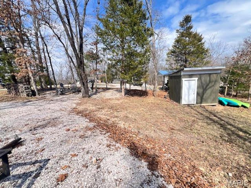 Can you imagine yourself spending countless hours with family and friends relaxing around that warm campfire? If so, let's make arrangements to see everything this full-time-camping lot has to offer! Relax by the fire this fall while glowing lights illuminate the evening or kick-back in the shade this summer after a day of boating and water activities. For storage, a small shed is located on the lot and gravel has been spread for your camper and parking. Electric and water utilities are present on the lot and sewer can be easily connected. Plus, Lake Perry amenities are all yours to enjoy – sandy beaches, fishing, gated pool area, shower house, laundry area, food area, 200 spring fed lake, volleyball area, horseshoe pits, playgrounds and so much more.