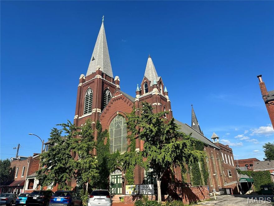 9th Street Abbey is one of the premiere wedding and event facilities in St. Louis.  Located in the heart of Historic Soulard, the Abbey was built in the 1850s as a church and schoolhouse.  The property enables great flexibility in creativity as a rental space.  The former church building can house up to 250 guests, with the former altar area now a stage.  The dual commercial catering kitchen can easily accommodate catering events or restaurant meals.  The spectacular garden area has an ivy-covered pergola, outside bar and patio for hosting unforgettable parties or events.  Wedding events often take full use of the inside space for the ceremony, followed by cocktails in the garden and finally a seated dinner back inside.  
Two incredible short-term rental units are also in the building.  The Schoolhouse at 9th Street Abbey sleeps 14 guests – 4 bedrooms, 7 beds and 2 baths.  The Rectory at 9th Street Abbey can accommodate 16+ guests - 5 bedrooms, 9 beds and 2.5 baths.  Both units are popular rentals on their own, but are often combined by so the entire property is used for a magical event weekend.
This very well maintained building has some newer A/C units, walk in freezers and coolers.  A new roof on the church was done this year.  All AirBnB furnishings, and most event space tables, chairs and other equipment included in the sale.  Don’t miss this amazing opportunity. 
1804 S 9th Street (Rectory) also included in sale.  Parcel 0383-9-184.000