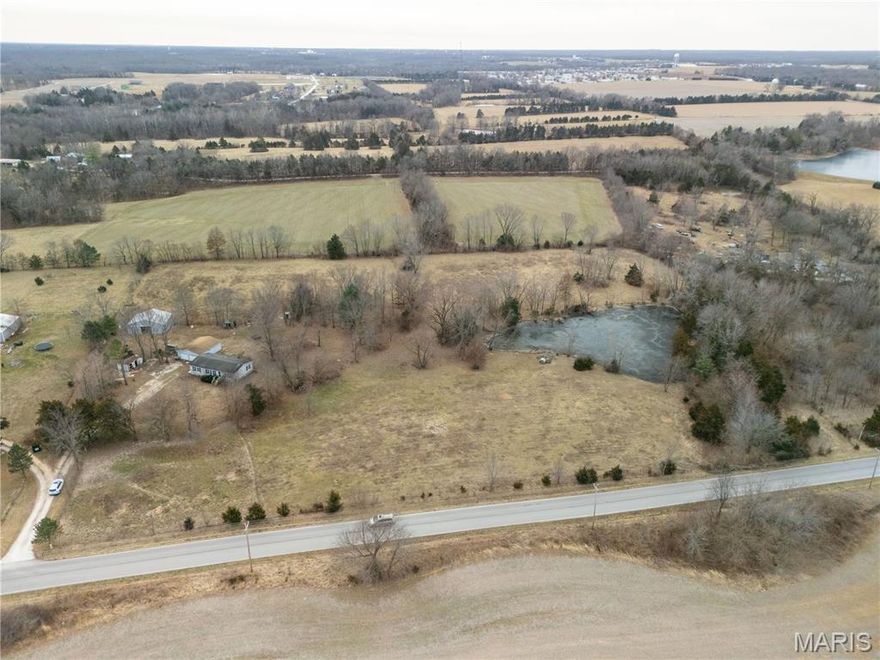 Surveyed 4.71 acre agricultural tract located just minutes from Warrenton with convenient access to major highways and approximately 45 minutes to St. Louis. The property features gently rolling topography, partial fencing, county road frontage, and a well-established pond set back from the road, providing privacy and a natural focal point for a future homesite.
The seller has completed key upfront work to streamline the build process, including a completed survey, professional septic design, and available quotes for septic installation and well drilling. No HOA and not located in a flood plain.
Suitable for a custom home, weekend retreat, or land investment. The adjacent parcel at 31226 S Rock Creek Road, which has a manufactured home and all utilities. is also available, offering the opportunity to combine for approximately 9+ acres (utilities on neighboring tract)."