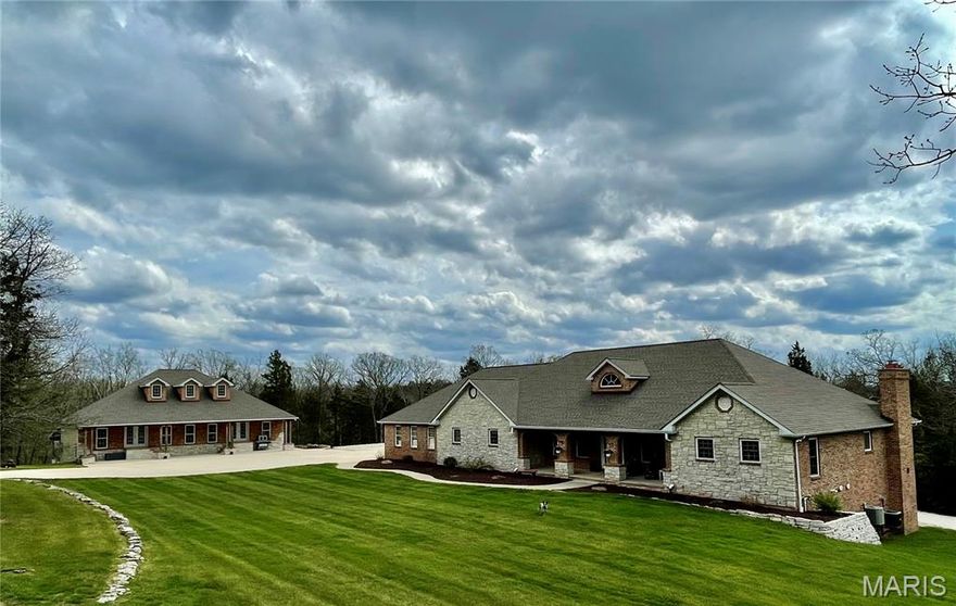 Here it is all you brick and stone lovers!!  This beautifully built and well constructed home is ready for you!  This 3,000 plus sq ft home has 4 bedrooms, 3 baths, large rooms, chef's dream kitchen with stainless steel appliances, lots of cabinets, so much counter space and a massive pantry!!  The home also has an open floor plan, beautiful entry foyer, 2 woodburning fireplaces, incredible primary bedroom, bathroom and walk in closet, main floor laundry, full basement, new huge deck and so much more!!  But, just wait til you walk out to the shop!!  It is 60 x 40 and constructed with brick and stone, to match the house!!  It has a 60 x 36 lean to, has heat and a/c, 200 amp service, dual overhead bridge crane system, 10,000 pound car lift, mechanical room, bathroom, 24 ft work bench, mezanine, and the list goes on!!  Additional 40 x 15 storage shed with concrete floor.  Automatic hard wired custom access gate with lights.  The park like sod yard has an irrigation system for yard and flower beds.  This all sits   in on two lots totaling over 10 acres in the Union School District.  Don't come and look at this one unless you're prepared to fall in love!!