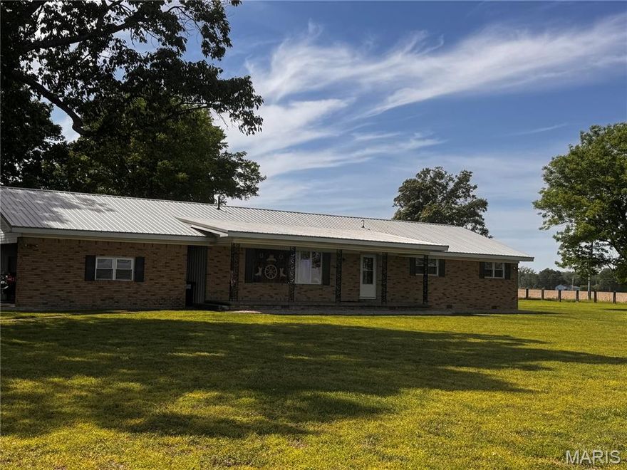 Have you been looking for a country property with room to roam?  This is it! This thoughtfully updated brick home features a metal roof, a gas log fireplace, and nice sized bedrooms with plenty of storage throughout.  Outside you will find a barn, a chicken coop and a pasture.  The 2 car carport area also has 2 storage rooms to keep your mower & tools handy.  This one is a must see, schedule your showing today.