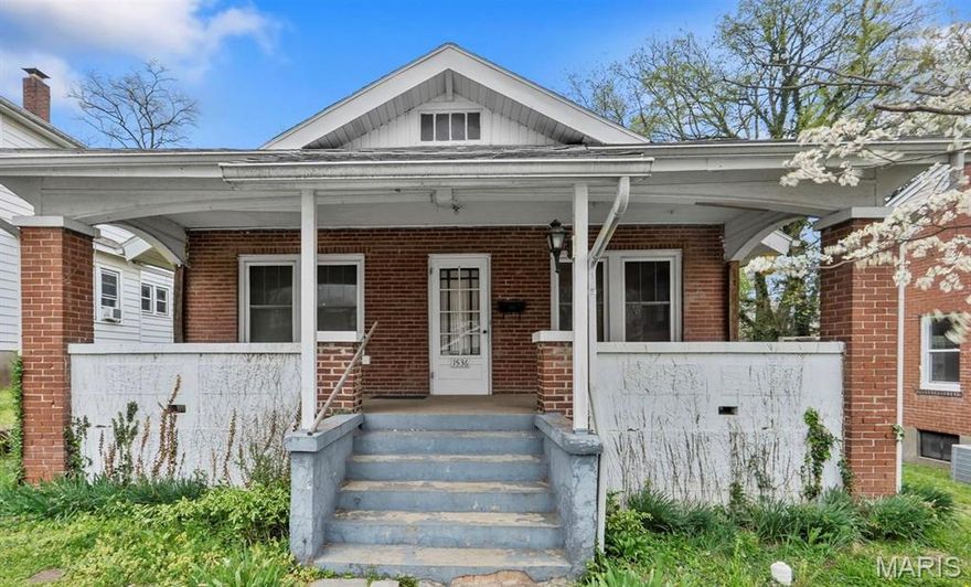 This absolutely adorable brick bungalow is the perfect blend of timeless character and cozy charm. It has been lovingly cared for by the owner and their family for many years. From the moment you arrive, the inviting covered front porch welcomes you in. Step inside to find warm, light-filled living spaces highlighted by beautiful hardwood floors and classic Craftsman trim work that add rich character throughout. The adorable kitchen features crisp white cabinetry, offering a fresh and cheerful space that’s as functional as it is charming. You’ll also appreciate that the windows have been replaced. Whether you’re looking for your first home or adding to your investment portfolio, this little gem is full of opportunity and heart.