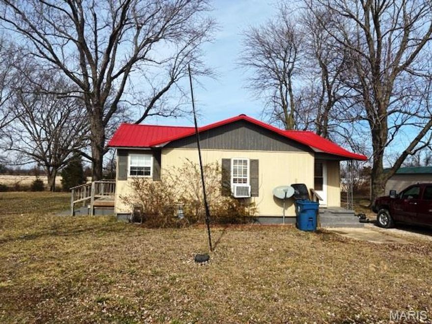 Nestled in the heart of a quaint, small-town setting, this delightful 2-bedroom, 1-bath bungalow offers comfort, simplicity, and timeless appeal. Perfect for first-time buyers, downsizers, or investors. Enjoy peace of mind with a newer metal roof, windows, and siding.