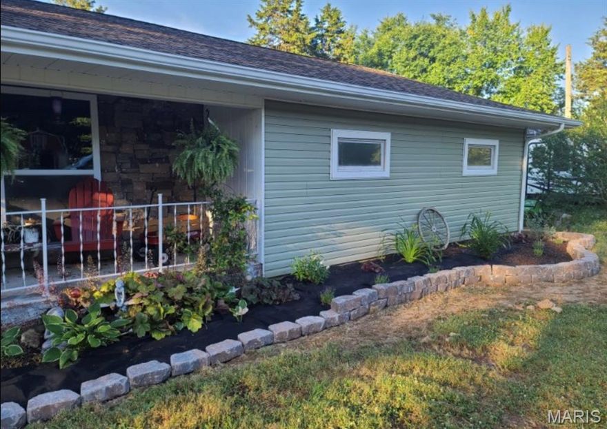 Enjoy the best of both worlds—city convenience with peaceful country views. This spacious home features generously sized rooms and abundant built-in storage, including ample closet space throughout. The main bathroom has been beautifully remodeled for a fresh, modern feel. Relax in the inviting family room/den with a natural gas fireplace insert, or step outside to the large covered back deck overlooking thoughtfully designed landscaping. The property includes fenced garden beds, a fenced above-ground pool, and a fenced bird enclosure previously used for ducks. Additional highlights include an attached two-car garage with an extra refrigerator and pull-down attic stairs providing even more storage. Situated on approximately 5.07 acres (+/-). Square footage and measurements are approximate (DSC-8001).