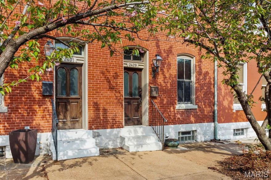 Come walk this oh-so-stylish 3 bedroom, 2.5 bath property with deluxe kitchen tucked right into the beating heart of the beautiful Benton Park neighborhood. Carefully maintained and tastefully updated since a gut renovation roughly 20 years ago, this historic townhome combines urban, contemporary style with the flavor of one the most architectural significant neighborhoods in STL. On the front stoop, step past the charming gas lantern and through the original arched window doorway into a handsome living room sporting high ceilings, lovely millwork, original heart-of-pine flooring and an ornate gas fireplace. The generous dining room is right off an eat-in chef's kitchen replete with storage, high-end stainless appliances (including a wine fridge), and granite countertops which are truly spacious enough for too many cooks. On floor 2 you'll find 2 beautifully outfitted bedrooms that both offer generous space, natural light and privacy. The primary suite sports lofted ceilings with skylight and an en-suite bath with a dual vanity and generous shower, as well as a gracious walk-in closet. An additional hall bath w/combined tub and shower guarantees plenty of elbow room in the a.m. The top level opens to a loft bedroom/play/work space with skylights and plenty of area to lay out the big projects. Out back discover a truly private courtyard with outdoor wood-burning fireplace for cool evening gatherings, and an enclosed single car garage. You'll appreciate the parking because this is an area made to explore on foot; stroll down to Blues City Deli for lunch, Venice Cafe for music, or cross the bridge into Soulard for the party. Did I mention that nearly all the tasteful contents are available for negotiation out of contract? All that's left for you to do is pack a suitcase and move in!