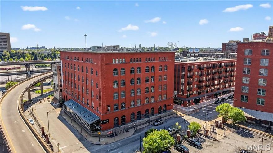 Experience true downtown living in this stylish loft at Ballpark Lofts, where character, convenience, and city energy come together! This 1-bed, 1-bath condo offers an open and airy floor plan with soaring ceilings, exposed brick, and concrete flooring that perfectly capture the industrial charm of the space, while warm, inviting finishes make it feel like home. The kitchen features custom cabinetry and stainless steel appliances, flowing seamlessly into the living and dining area, ideal for entertaining or relaxing after a day in the city. The spacious bedroom provides a comfortable retreat, and in-unit laundry adds everyday convenience. Enjoy access to premium building amenities, including a rooftop deck with incredible city and stadium views. Located in the heart of downtown, just steps from Busch Stadium, Enterprise Center, dining, nightlife, and entertainment, this is the perfect opportunity for low-maintenance living in one of St. Louis’ most vibrant areas. Seller's prefer to sell the unit fully furnished, but can make arrangements otherwise.
