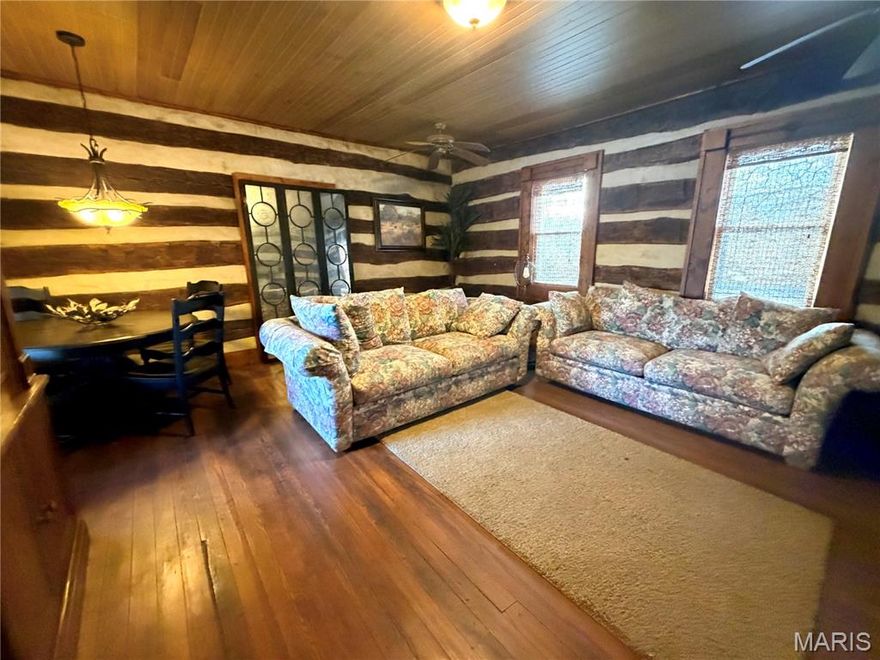 Well, here's your chance!!!  54 acres just west of Union on Hwy 50!!  These don't come up often!!  Original log home was built in 1847 and has had some renovation work.  Addition to the home was done in 2000 and is beautiful!!  A kitchen to fall in love with, breakfast nook, 2 bathrooms and a bedroom.  Living room has original exposed logs, nice fireplace and hardwood floors!!  Outside you'll find a charming,  old red barn, equipment shed and a 60 x 40 outbuilding with overhead door, concrete floor, heat, electric and another bathroom!!  Beautiful acreage and a location perfect for full time living or a weekend place!  Off the beaten path yet not far from the beaten path....