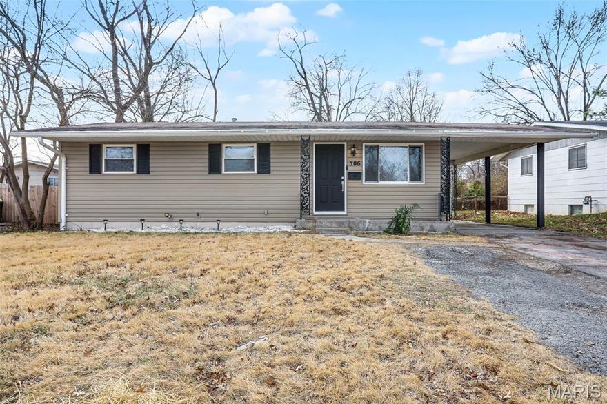 Beautiful 3-bedroom, 1-bath home with basement and the updates are the real deal! This move-in ready home has been transformed with a modern aesthetic throughout. The stunning kitchen is the showstopper, featuring white shaker cabinetry, quartz countertops, subway tile backsplash, and a bold island with range and hood. Complete with a refrigerator, black dishwasher, and a workstation sink with a matte black pull-down faucet, this kitchen checks every box. The open living and dining area flows beautifully from the kitchen pass-through and boasts new flooring, recessed lighting, and a stylish ceiling fan. The bathroom has been completely reimagined with large-format marble-look tile, a stunning ribbed black vanity, LED backlit mirror, matte black fixtures throughout, and hexagon tile flooring. The full basement offers incredible bonus square footage with rooms, new carpet, a painted exposed ceiling with recessed lighting, and abundant built-in shelving and storage, ideal for a rec room, home gym, or workshop. Outside you'll find a covered carport, a patio with pavers, a spacious backyard with a chain link fence, and a large open yard with plenty of room to make it your own. Additional updates include a brand new AC unit, giving you peace of mind for years to come.