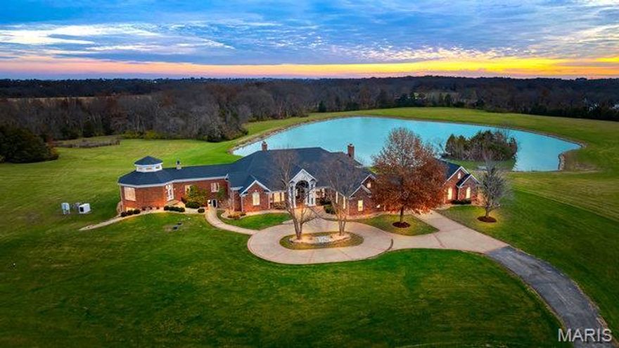 11,000 sq ft Multigenerational Estate on 59+- ac w/private lake. Lower level offers space perfect for mother-in-laws/secondary living  w/2nd full kitchen, 2nd full laundry, 2 more bedrooms, gym, family/media room w/fireplace & full bar-all walks out to large patio & pool. Main floor features 18' ceilings, striking millwork, triple crown, coffered tray ceilings & custom columns. Luxury Primary suite offers dual closets, wet bar, FP, separate bathrooms & water closets w/access to Grand gazebo w/wet bar & access to outside. Two more ensuites on main floor feature walk in closets. Main Chef's kitchen offers center cooktop & custom hood, bkfst dining leads to deck w/breathtaking view. Large living rm features woodburning FP, custom panoramic doors open to the sunroom. 60x46X14'T Outbuilding - Dual Climate controlled w/2 bi-fold hanger doors & water. Whole house back up generator. Additional outbuilding measures 35x24x11'T w/2 overhead doors. Located just minutes from 2 major interstates. Suitable for Bed/Brk Additional Rooms: Sun Room, Wine Cellar