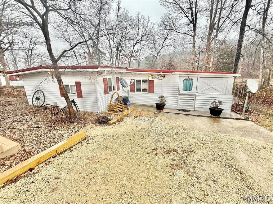Discover this charming 2-bedroom, 1.5-bath ranch home with fantastic updates! The seller has added a newer roof, kitchen cabinets, countertops, updated flooring, a 200-amp electric panel with newer wiring, and PEX piping throughout. Stay comfortable year-round with the efficient mini-split system, which keeps heating and cooling costs low. Never worry about power outages with the whole-house generator! Enjoy entertaining on the covered patio, and take advantage of lake access with your own private dock. Two storage sheds provide extra space, and there’s even an RV spot with electric and sewer hookups. The seller is offering the camper for an additional $10,000—perfect for extra guests or weekend getaways. Don’t miss this amazing opportunity!