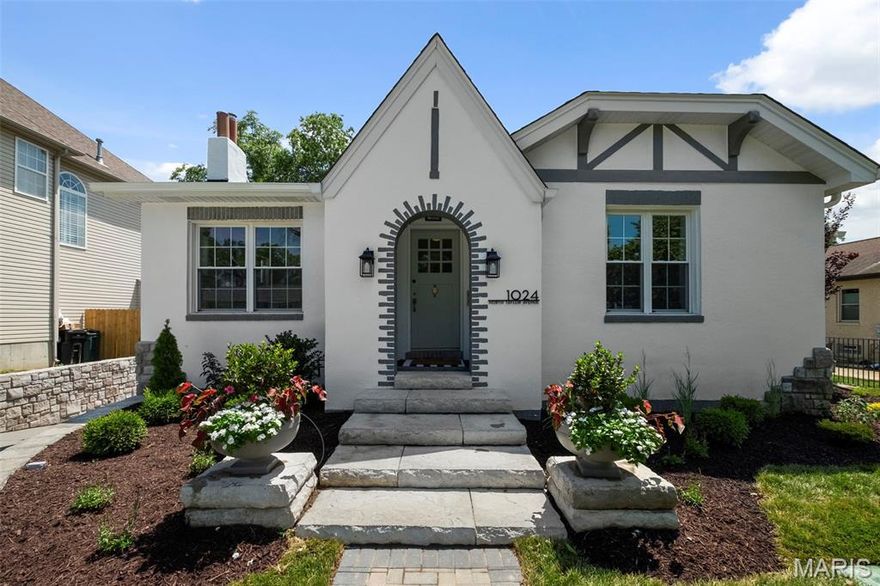 Discover the perfect blend of historic charm and modern luxury in this reimagined 1928 Tudor-Revival home in Kirkwood’s North Taylor Historic District. Walkable to downtown Kirkwood and Tillman Elementary, this 4-bedroom, 3-bath residence spans over 3,500 sq ft and features a seamless addition that enhances both space and style. The stucco exterior, arched entryway, and decorative brickwork preserve its timeless character, while inside, a gourmet kitchen with custom Amish cabinetry and natural quartzite surfaces anchors the home. The main-level primary suite offers a spa-like retreat with a custom tile shower, soaking tub and custom closets. Enjoy dual-zone HVAC, laundry on both levels, two linear gas fireplaces, and a composite deck with access from both floors. A private lower-level entry opens to a flagstone courtyard, and the oversized 2-car garage is tucked away for added privacy. With all-new landscaping and a full sprinkler system, this home is truly move-in ready.