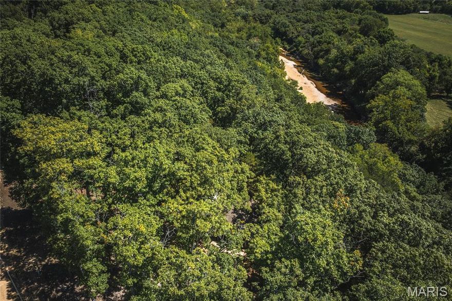 Discover Klein Ford on the crystal-clear Upper Meramec River in Crawford County, Missouri—just 1 hour and 20 minutes from St. Louis County. This recreational gem offers prime river frontage in the heart of Missouri’s floating capital, where canoeing, kayaking, rafting, and fishing are a way of life. Trophy smallmouth bass thrive here, along with largemouth bass and goggle eye, while world-class trout fishing awaits nearby at Maramec Springs, one of Missouri’s best trout fisheries. Perched safely above the floodplain, the charming rustic river cabin provides sweeping views of the Meramec and the surrounding Ozark countryside. With updated electric, accommodations to sleep up to 17 guests, and a convenient shower house, the property is ideal for family gatherings, outdoor adventures, or group retreats. The cabin itself is a blank slate, ready to be finished and customized into your perfect getaway. Deer and turkey frequent the area, and nearby Mark Twain National Forest offers endless opportunities for hunting, hiking, and exploring. Add in renowned Missouri wineries just minutes away, and you’ll find this is more than a property—it’s a destination. Whether casting a line, floating the river, or simply relaxing on the porch, Klein Ford is where Ozark dreams come true.